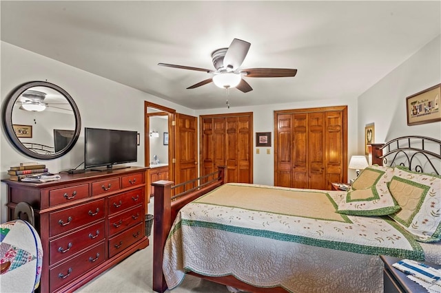 44 Stonehenge Dr, South Strabane, PA 15301 - bedroom with multiple closets, light carpet, and ceiling fan
