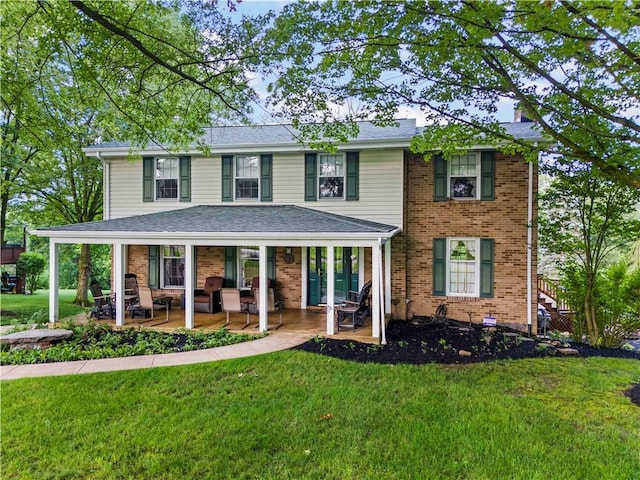 44 Stonehenge Dr, South Strabane, PA 15301 - view of front of property with a front yard and brick siding