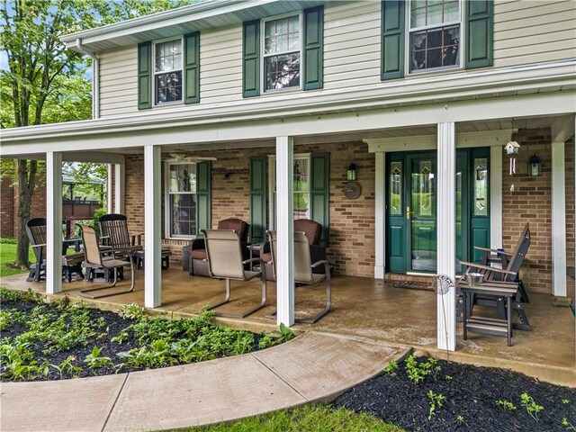 44 Stonehenge Dr, South Strabane, PA 15301 - view of exterior entry featuring brick siding and a porch