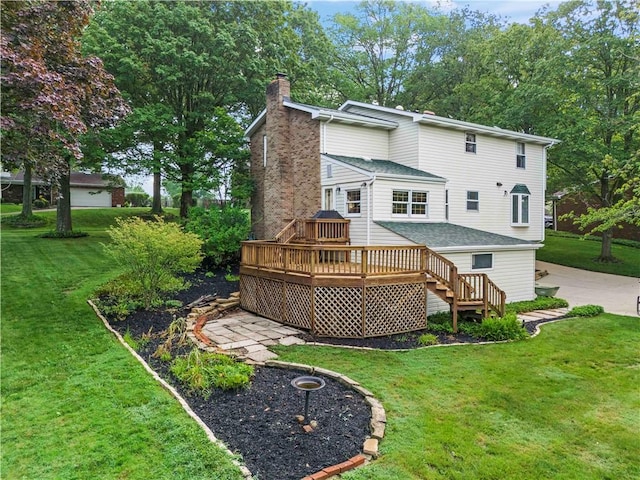 44 Stonehenge Dr, South Strabane, PA 15301 - rear view of property featuring a chimney, a deck, and a lawn