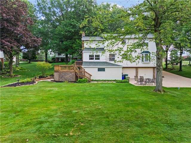 44 Stonehenge Dr, South Strabane, PA 15301 - view of green lawn featuring a deck, an attached garage, stairs, and driveway