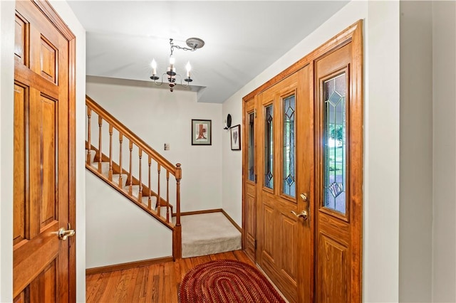 44 Stonehenge Dr, South Strabane, PA 15301 - entrance foyer with a chandelier, stairway, and wood finished floors