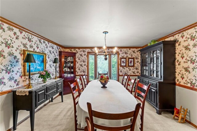 44 Stonehenge Dr, South Strabane, PA 15301 - dining space with wallpapered walls, light carpet, a chandelier, and ornamental molding