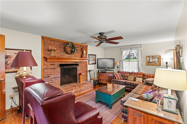 44 Stonehenge Dr, South Strabane, PA 15301 - living room with ceiling fan, wood finished floors, and a fireplace