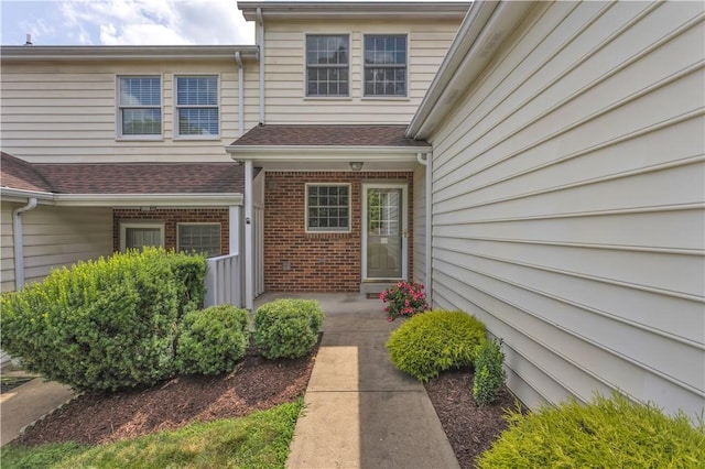 103 Boxwood Ct, Peters Twp, PA 15317 - doorway to property featuring brick siding and roof with shingles