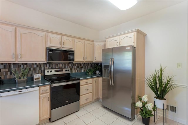 103 Boxwood Ct, Peters Twp, PA 15317 - kitchen with stainless steel appliances, light brown cabinets, dark countertops, tasteful backsplash, and light tile patterned flooring