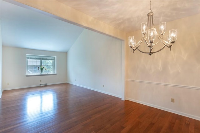 103 Boxwood Ct, Peters Twp, PA 15317 - empty room featuring a chandelier, dark wood-style flooring, and vaulted ceiling