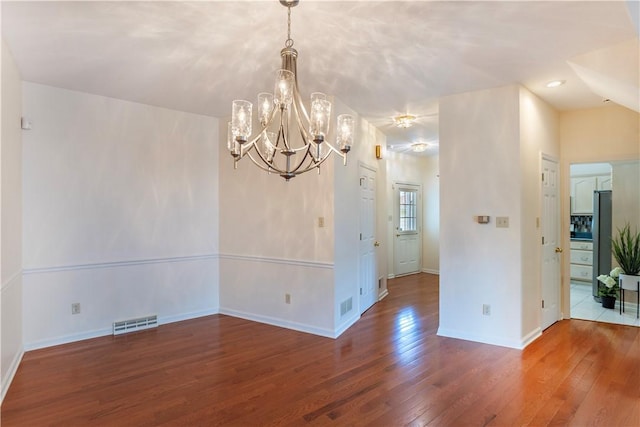 103 Boxwood Ct, Peters Twp, PA 15317 - empty room with hardwood / wood-style floors and a chandelier