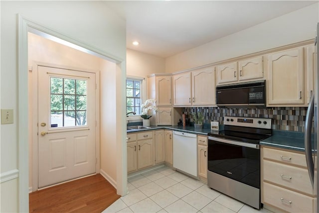 103 Boxwood Ct, Peters Twp, PA 15317 - kitchen featuring black microwave, stainless steel electric range oven, white dishwasher, dark countertops, and backsplash