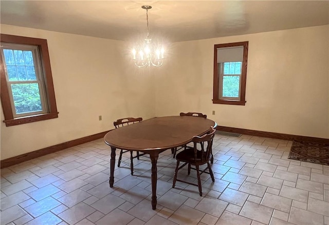 423 Bonniebrook Rd, Summit Twp, PA 16002 - dining room featuring a chandelier and baseboards