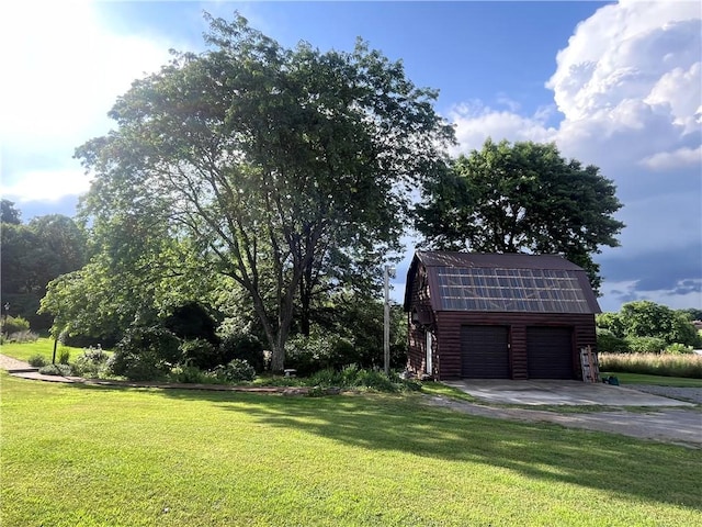 423 Bonniebrook Rd, Summit Twp, PA 16002 - view of green lawn featuring driveway, an outdoor structure, and an attached garage