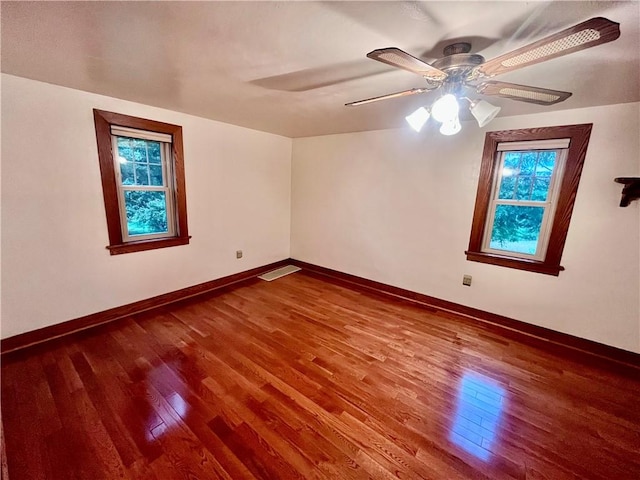 423 Bonniebrook Rd, Summit Twp, PA 16002 - unfurnished room with wood finished floors, healthy amount of natural light, and ceiling fan