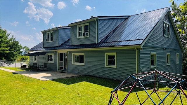 324 Paul Dr, Lower Burrell, PA 15068 - rear view of house with a patio and a metal roof