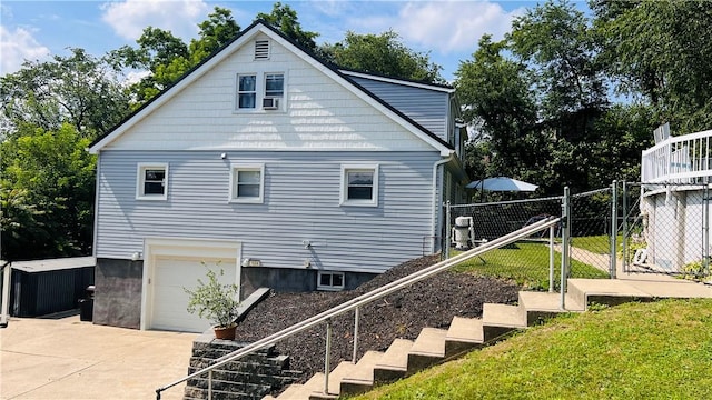 324 Paul Dr, Lower Burrell, PA 15068 - view of side of property with an attached garage and driveway