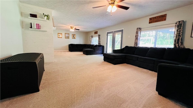 324 Paul Dr, Lower Burrell, PA 15068 - living room with a ceiling fan, carpet, a textured ceiling, and french doors