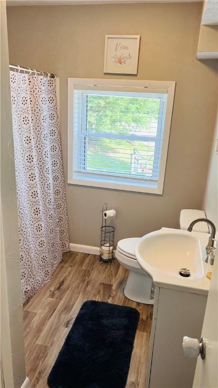 324 Paul Dr, Lower Burrell, PA 15068 - full bathroom with vanity, wood finished floors, and a shower with curtain