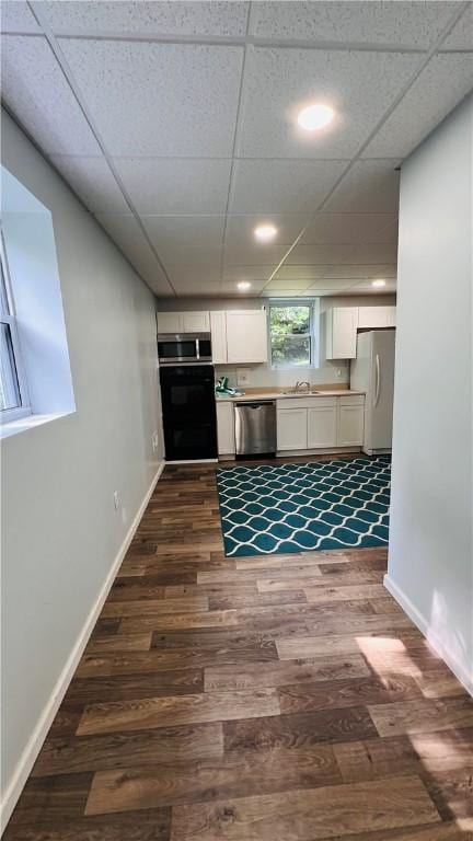 324 Paul Dr, Lower Burrell, PA 15068 - kitchen featuring stainless steel appliances, dark wood-style flooring, white cabinetry, recessed lighting, and light countertops