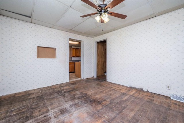 1115 Fairdale St, Sheraden, PA 15204 - spare room featuring wallpapered walls, wood finished floors, ceiling fan, and a paneled ceiling