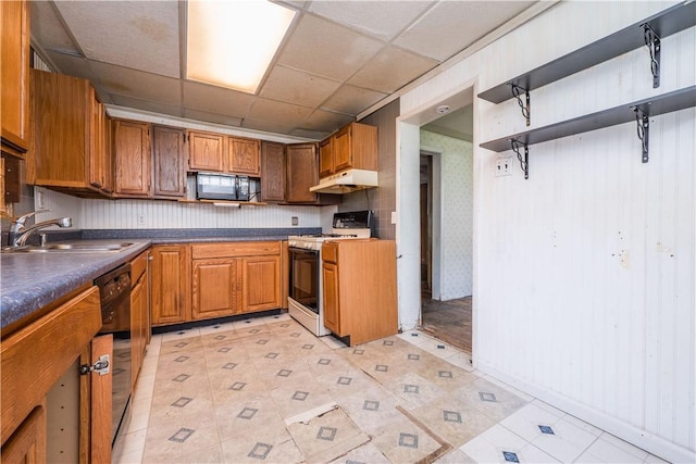 1115 Fairdale St, Sheraden, PA 15204 - kitchen featuring black appliances, under cabinet range hood, brown cabinets, a drop ceiling, and dark countertops
