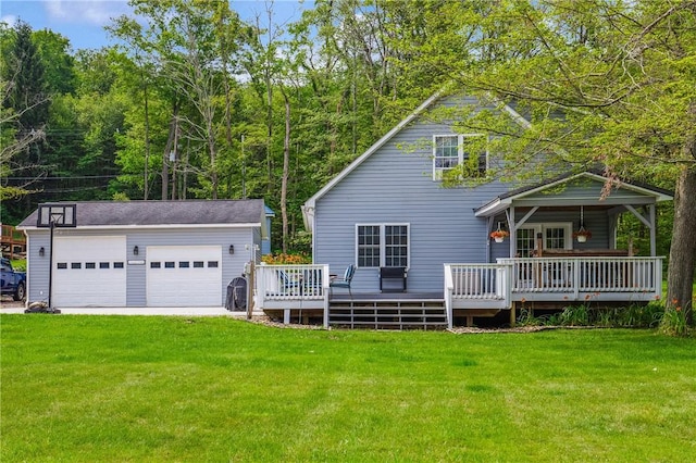 604 Lake Shore Rd, Lake Stonycreek, PA 15541 - back of property featuring an outdoor structure, a lawn, a wooden deck, and a detached garage