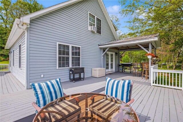 604 Lake Shore Rd, Lake Stonycreek, PA 15541 - deck featuring french doors, outdoor dining area, cooling unit, and grilling area