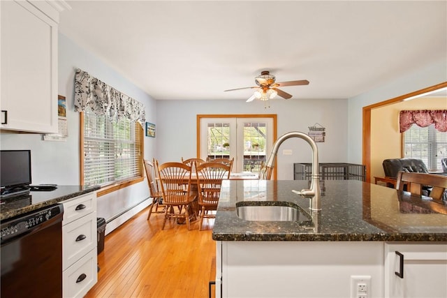 604 Lake Shore Rd, Lake Stonycreek, PA 15541 - kitchen featuring black dishwasher, a baseboard heating unit, a ceiling fan, and plenty of natural light