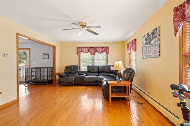 604 Lake Shore Rd, Lake Stonycreek, PA 15541 - living room featuring a baseboard radiator, a ceiling fan, and light wood-type flooring