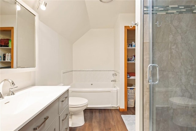 604 Lake Shore Rd, Lake Stonycreek, PA 15541 - bathroom featuring wood finished floors, vanity, a shower stall, a garden tub, and vaulted ceiling