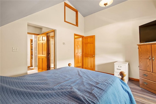 604 Lake Shore Rd, Lake Stonycreek, PA 15541 - bedroom featuring wood finished floors and high vaulted ceiling