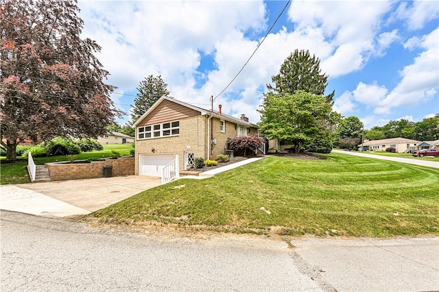 127 Mount Odin Dr, Hempfield Twp, PA 15601 - view of front of property with a garage, concrete driveway, a front yard, brick siding, and a chimney