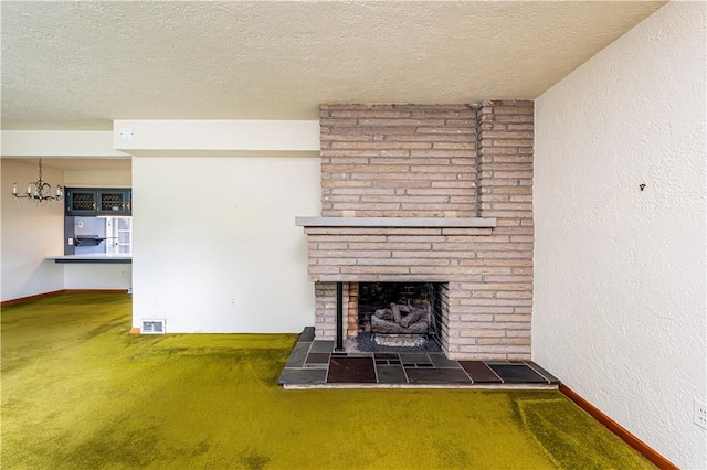 127 Mount Odin Dr, Hempfield Twp, PA 15601 - unfurnished living room with carpet floors, a fireplace with raised hearth, a textured ceiling, a chandelier, and a textured wall