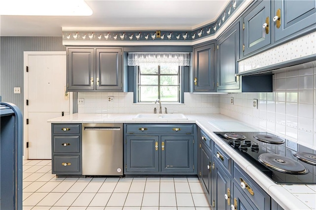 127 Mount Odin Dr, Hempfield Twp, PA 15601 - kitchen with stainless steel dishwasher, black electric stovetop, backsplash, tile countertops, and light tile patterned flooring