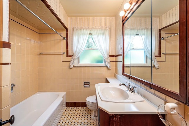 127 Mount Odin Dr, Hempfield Twp, PA 15601 - full bathroom with wallpapered walls, shower / tub combination, vanity, tile walls, and a wainscoted wall