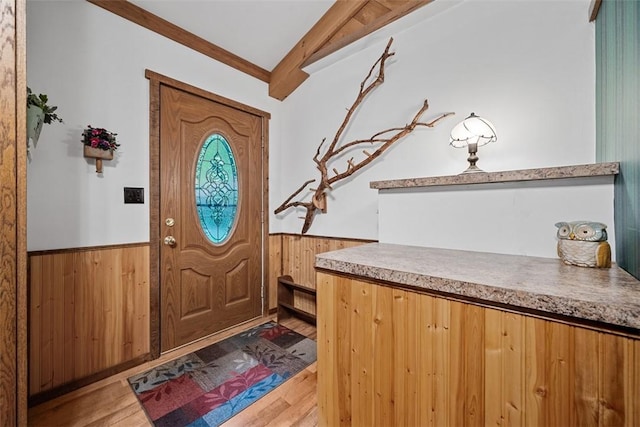 71 Mcclure Rd, West Deer, PA 15024 - entryway featuring a wainscoted wall, wooden walls, light wood-type flooring, and beam ceiling