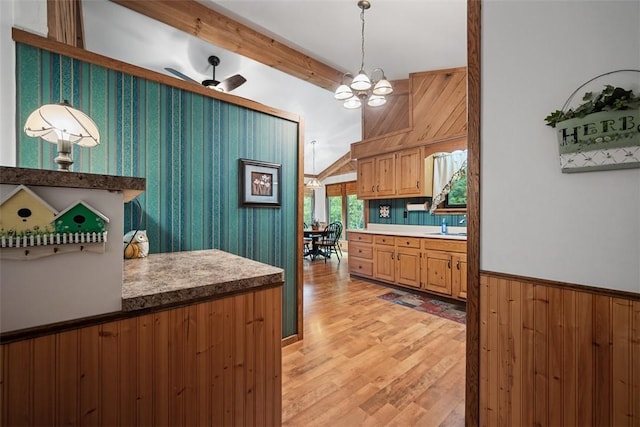 71 Mcclure Rd, West Deer, PA 15024 - kitchen featuring light wood-style floors, decorative light fixtures, a chandelier, beamed ceiling, and light countertops