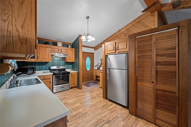 71 Mcclure Rd, West Deer, PA 15024 - kitchen with appliances with stainless steel finishes, under cabinet range hood, vaulted ceiling, a chandelier, and light countertops
