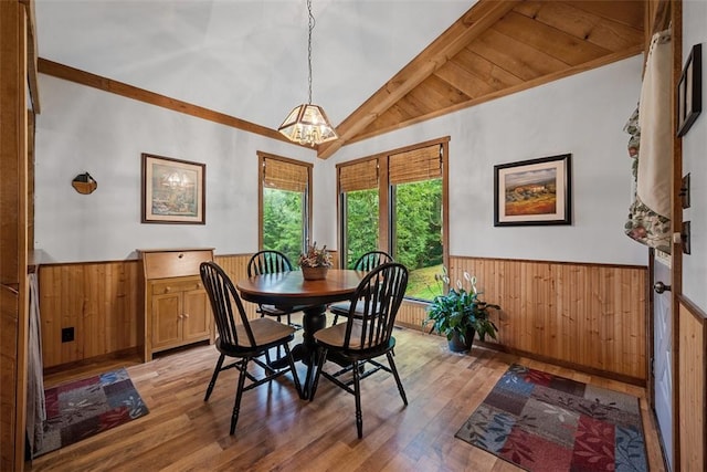 71 Mcclure Rd, West Deer, PA 15024 - dining area featuring wainscoting, a chandelier, wood walls, and light wood-style flooring