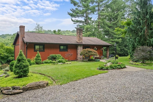 71 Mcclure Rd, West Deer, PA 15024 - back of house featuring a chimney and a yard