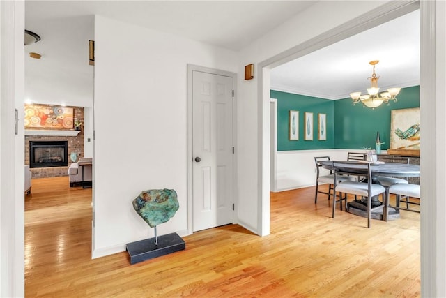 114 Franklin Oaks Dr, Franklin Twp, PA 16001 - hall featuring wood finished floors and a chandelier