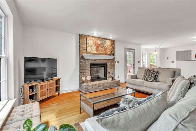 114 Franklin Oaks Dr, Franklin Twp, PA 16001 - living room with light wood-type flooring and a fireplace