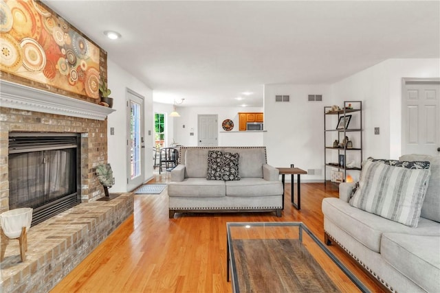 114 Franklin Oaks Dr, Franklin Twp, PA 16001 - living area with light wood-style floors, a fireplace, and recessed lighting