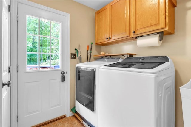 114 Franklin Oaks Dr, Franklin Twp, PA 16001 - washroom featuring washer and clothes dryer, cabinet space, and light tile patterned floors