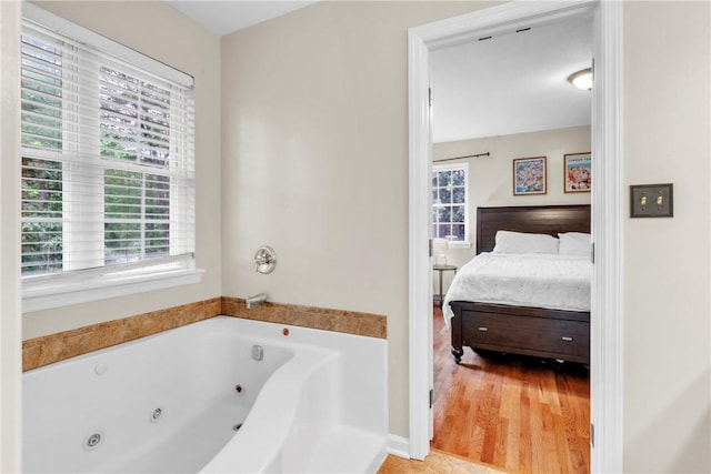 114 Franklin Oaks Dr, Franklin Twp, PA 16001 - ensuite bathroom with a jetted tub and wood finished floors