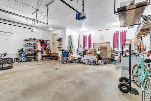 114 Franklin Oaks Dr, Franklin Twp, PA 16001 - garage featuring a garage door opener