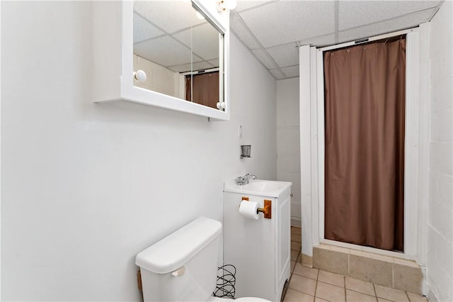90 S Thompson Ln, North Huntingdon, PA 15642 - bathroom with a drop ceiling, curtained shower, tile patterned flooring, and vanity