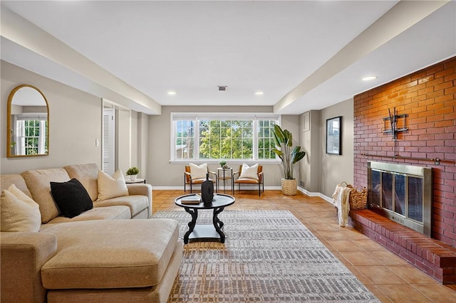 2671 Thorntree Dr, Saint Clair, PA 15241 - living area featuring light tile patterned floors, plenty of natural light, a brick fireplace, and recessed lighting