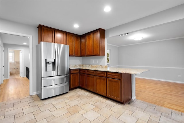 2671 Thorntree Dr, Saint Clair, PA 15241 - kitchen with stainless steel refrigerator with ice dispenser, a peninsula, light stone counters, light wood-type flooring, and recessed lighting