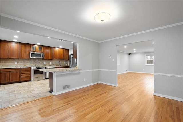 2671 Thorntree Dr, Saint Clair, PA 15241 - kitchen featuring stainless steel appliances, light wood-style floors, backsplash, ornamental molding, and glass insert cabinets