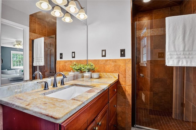 2671 Thorntree Dr, Saint Clair, PA 15241 - full bathroom with vanity, a shower stall, tile walls, ensuite bathroom, and ceiling fan