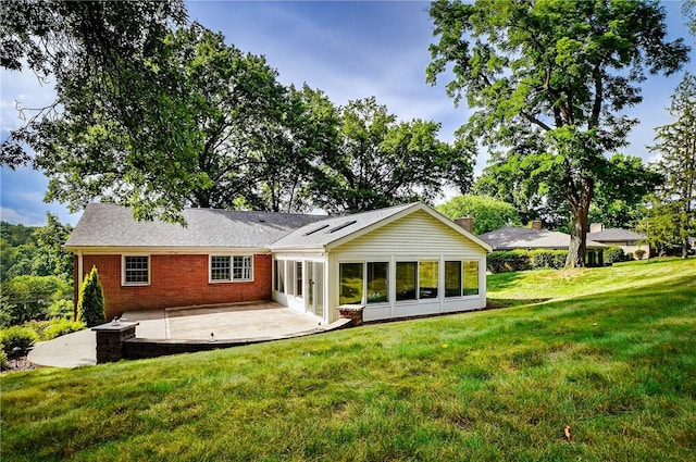 2671 Thorntree Dr, Saint Clair, PA 15241 - rear view of property with a patio, brick siding, a lawn, and a sunroom